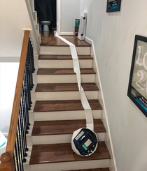 Roomba Suicide in my House last night It somehow wrapped up its sensors in TP and headed off the edge