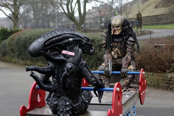 A Xenomorph from Alien and a Predator Frolicking together blissfully