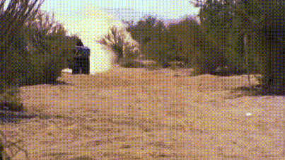 An off-road racing truck literally flying over the bumps 