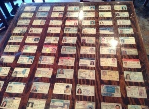 Bar decorates their tables with seized fake IDs