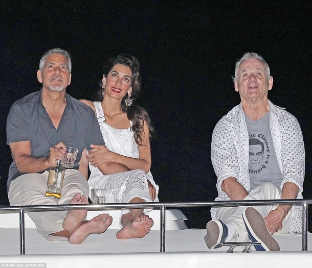 Bill Murray wearing a George Clooney Is A Beautiful Man shirt while watching fireworks with George Clooney