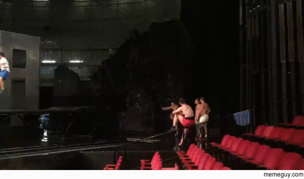 Cirque Du Soleil Tumbler Performing a Double Layout Split on powertrack