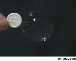 Dissolving an Alka-Seltzer tablet in a water bubble in zero gravity