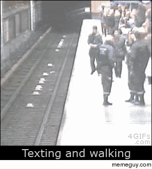 Guy texting and walking in the subway