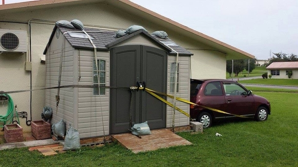 Japan typhoon-secure the car to the shed and secure the shed to the house