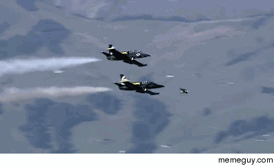 Jetman flies with the Breitling Jet Team