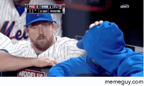 John Buck comforting Matt Harvey after learning that Harvey will be shut down for the season and may need Tommy John surgery 