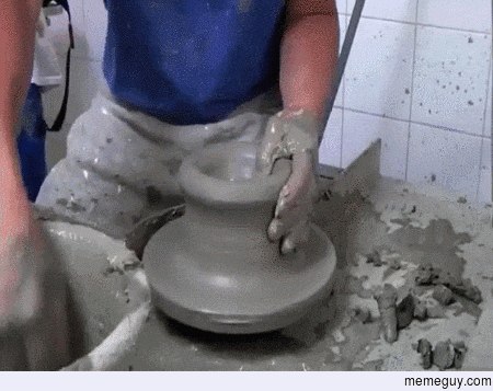 Making clay pottery using a Potters Wheel