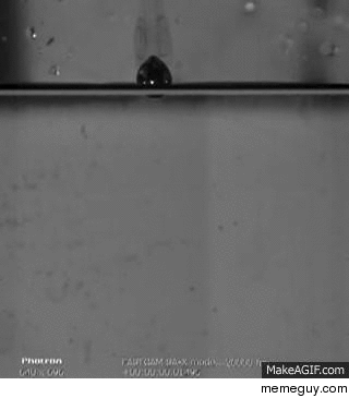 Molten lead droplet hitting water in slow motion 