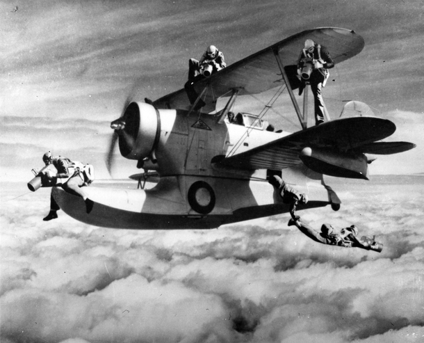 Montage by the well-known photographer Anonymous used in a squadron Christmas card  It features some of VJ-s enterprising photographers working to get the best possible camera angles from positions aboard a Grumman JF Duck