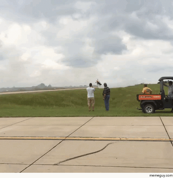 Motorcycle Jumps over Low-Flying Plane