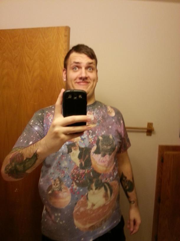My Brothers girlfriend bought me this shirt Nothing says credible boss like galaxy kittens riding Donuts On a side note I sent this to every girl I ever slept with hoping they would utter oh god I cant believe he was inside me