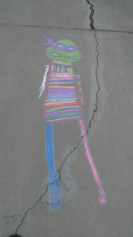My nephew told me my TMNT chalk drawing wasnt very good and insisted on drawing the body for me