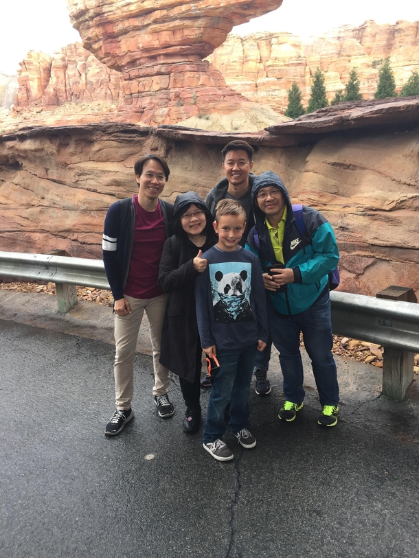 My son was asked to take a picture of a nice Asian family at Disneylandhe did not understand