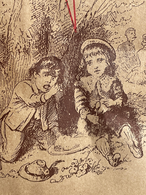 On a Trader Joes bag Im pretty sure the kid on the left is supposed to be eating but he looks like hes high as a kite and just discovered his own hand