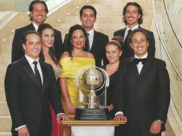 Pic #1 - All of these dumb-asses have each given Scientology  million so they could pose for these stupid pictures next to those stupid trophies