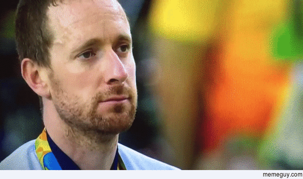 Sir Bradley Wiggins pulling a face during the national anthem in the gold medal ceremony
