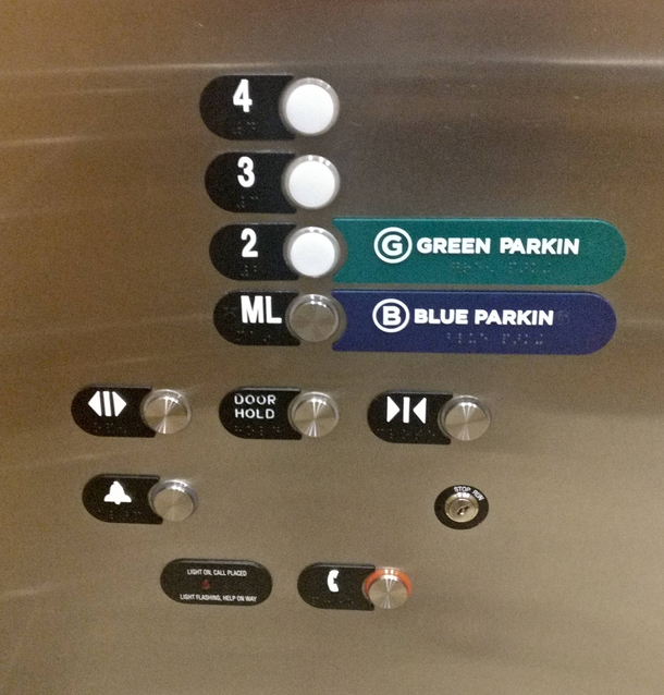 Someone pried off the Gs off of the words parking in the elevator of a suburban Atlanta hospital to reflect the correct local pronunciation
