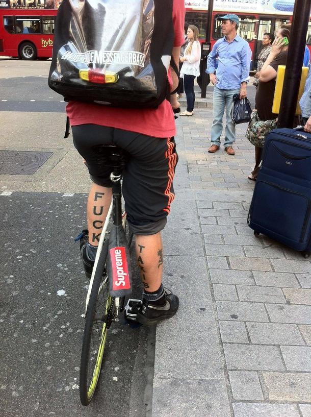 Spotted this guy cycling through London Best bike messenger tattoo ever
