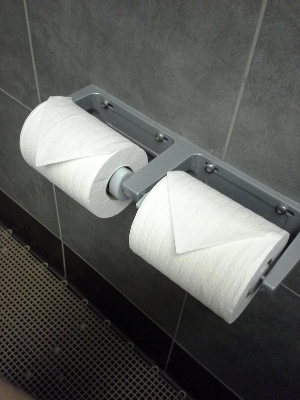 The rolls are neatly folded like this every morning when I come into work Thank you hardworking stranger Now if youll excuse me Im going to rip it off and smear shit on it