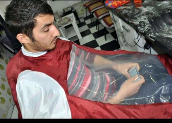 The Turkish barber considers his phone-addicted customers