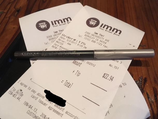 The waitress gave me this pen for signature