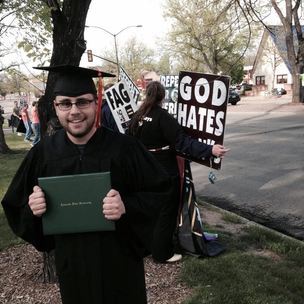 The Westboro Baptist Church came to protest my graduation yesterday so I decided that the best way to react to this was by getting a nice graduation photo with them in my cap and gown