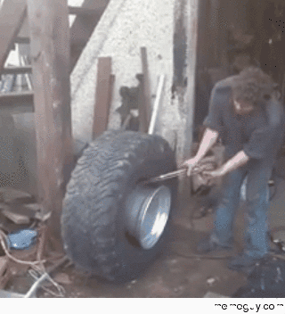 This is the manliest way to put the tire on the rim I have ever seen