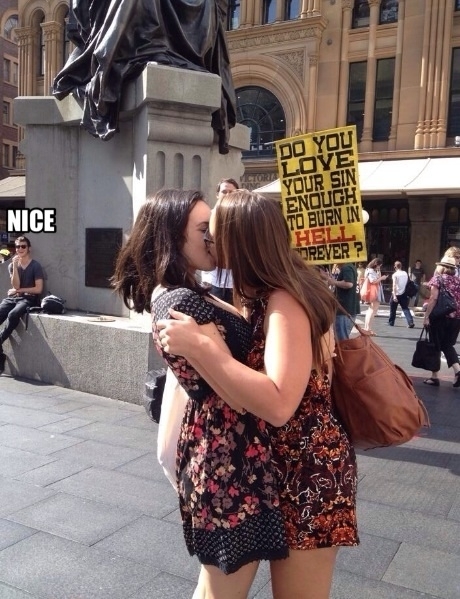 Two lesbians protesting a protester
