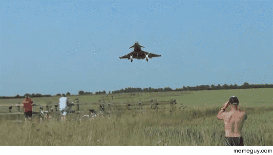 Typhoon jet flys ridiculously close to the ground over people