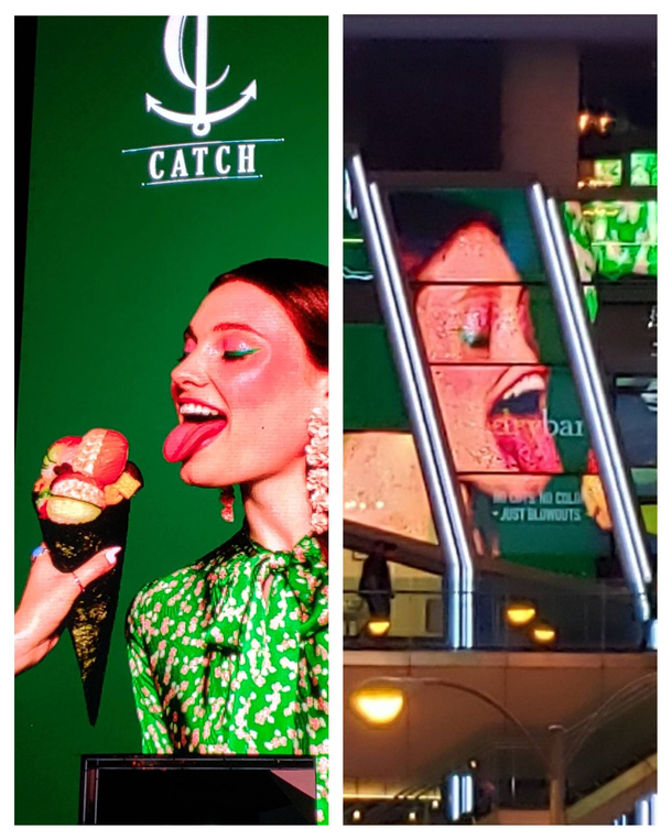 Video screen billboard ad in Vegas and the same ad reflected in the windows across the street