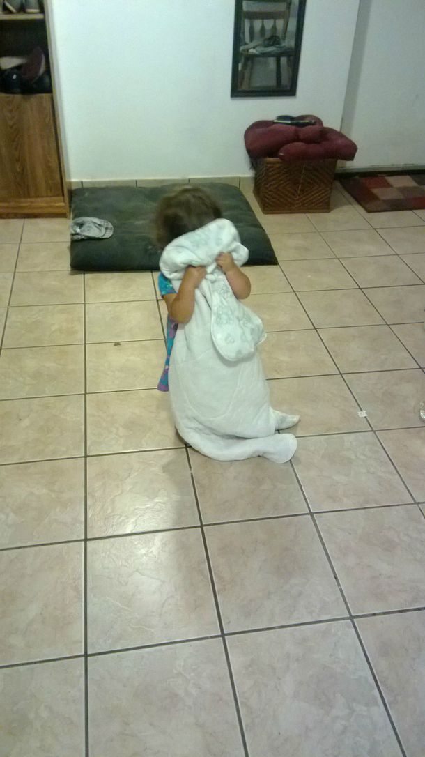 Was playing hide and go seek with my  year old niece turned the corner to see her hiding like this completely immobile