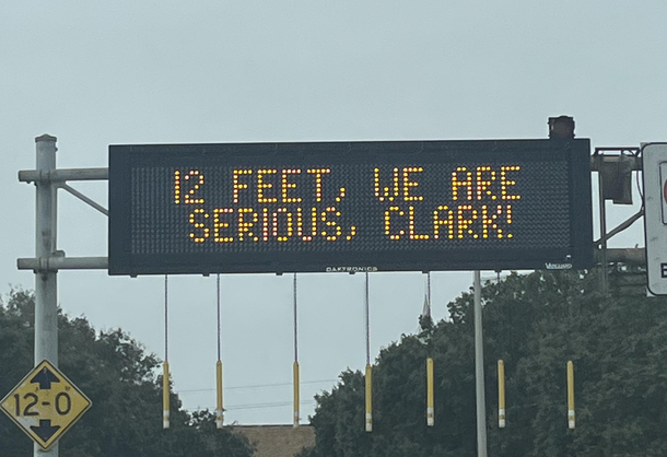 We are serious Clark Sign over a tunnel entrance