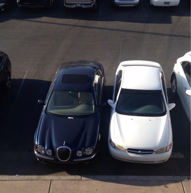 What to do when a Jaguar parks over two spots at the front in a busy lot White Nissan is me OC