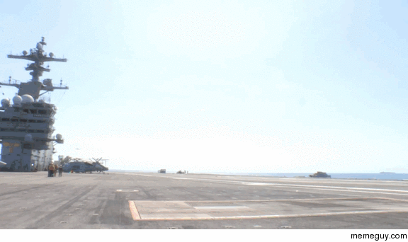 X-B unmanned combat air vehicle  performs a fully automated touch-and-go on the deck of the USS George H W Bush 