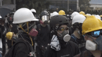  Hong Kong Protesters Testing Out Their Helmets Before The Police Raid