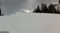  skiers do a backflip while holding hands