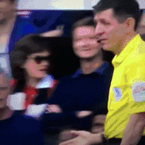 A blind man offers the referee his walking stick