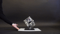 A Cube That Can Jump Up Balance and Walk