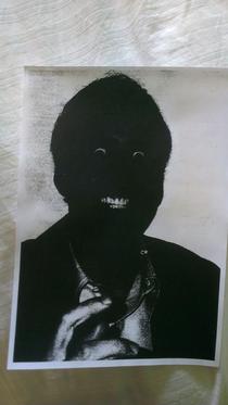 A friends printer broke heres the result of him printing off a picture of Nicolas Cage
