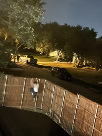 A truck crashed and flipped on its side in our neighborhood I ran and climbed the fence to see whats going on my wife snapped this picture that makes it look like Im running away from the accident scene
