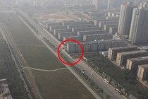 China Accidentally Builds Building In the Middle of Highway Decides To Leave It