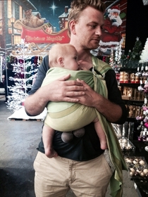 Christmas shopping with the family My wife asked if the baby carrier was maybe cutting off my sons circulation