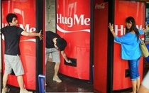Coca-Cola has created a vending machine which gives out free cans of Coke in return for hugs
