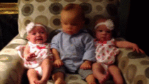 Confused baby meets twins