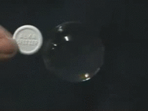 Dissolving an Alka-Seltzer tablet in a water bubble in zero gravity