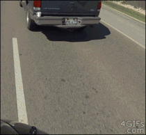 Driver mugged by passing motorcyclist
