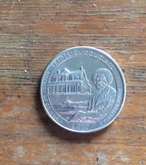 First glance i thought when did they put Bob Ross painting a house on a quarter 