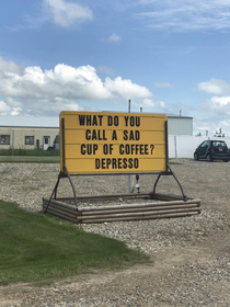 Funny coffee shop sign on the side of the highway in Saskatchewan