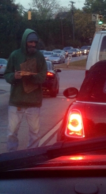Guy in front of me at the stop light gave this homeless guy a piece of pizza